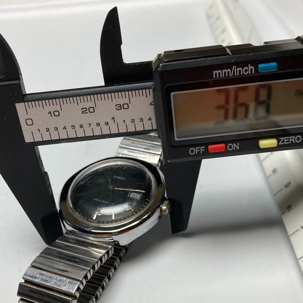 Vintage Timex black dial watch, works, stainless stretch bracelet